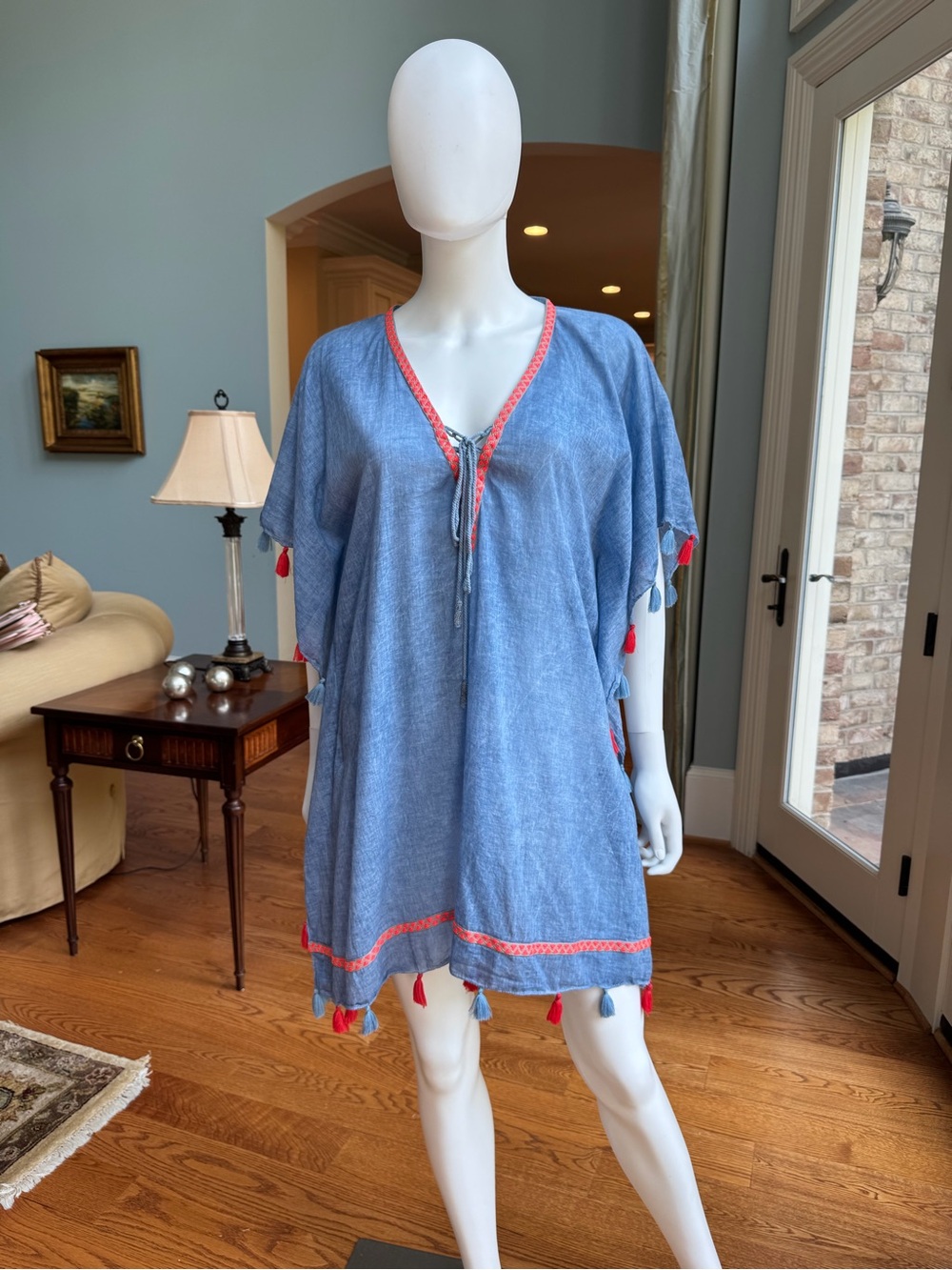 Handcrafted Blue Linen Garment with Decorative Tag